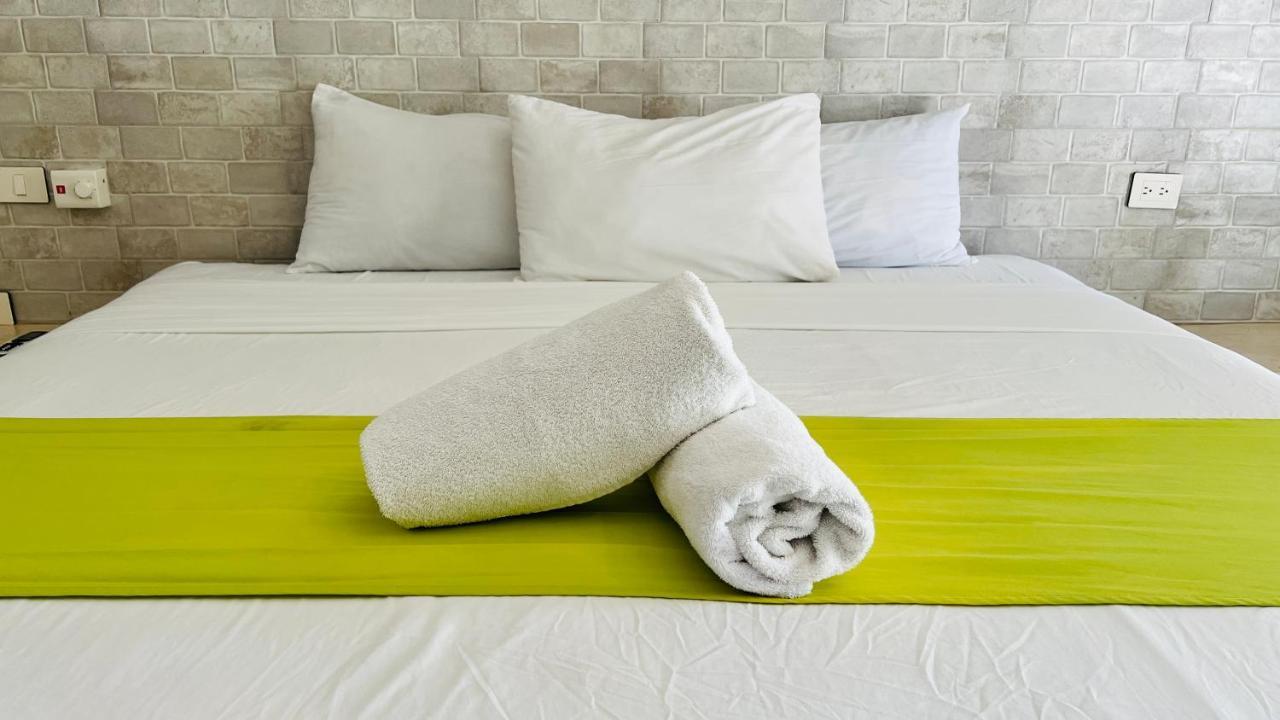 Hotel Mayari Holbox Ilha Holbox Exterior foto Bath towels on a bed
